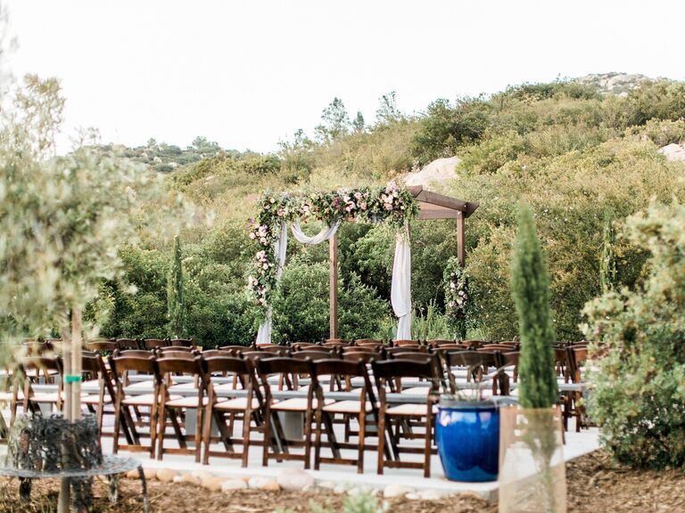 The chairs are ready for an outdoor vineyard wedding celebration