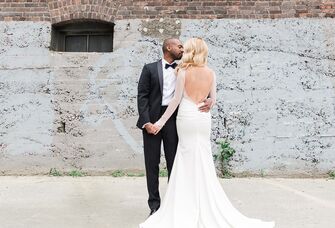 Groom kissing his bride on the cheek