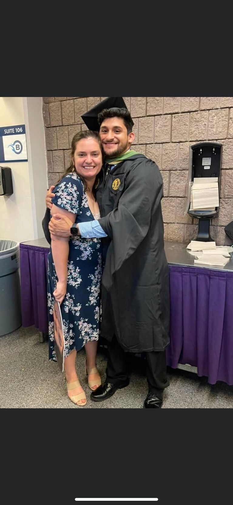 Jonathan compeltes his Master's degree in Athletic Training while Hannah cheers him on with a giant picture of his head on a stick :) 