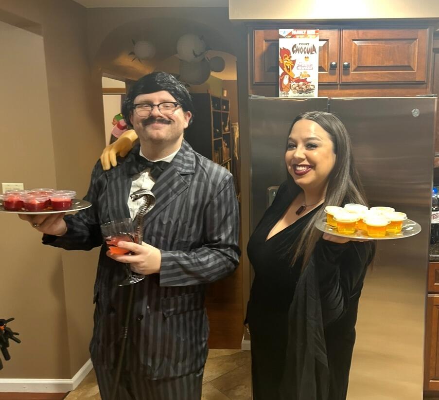 Hosted our first-ever Halloween Party as Morticia & Gomez Addams.