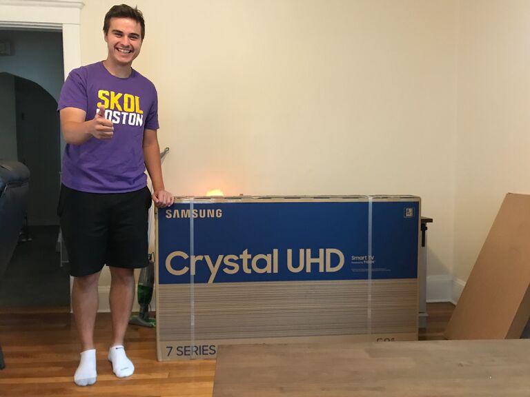 Brighton, MA: We moved into our first place together! Of course, Kevin was very particular about the size of our TV. 