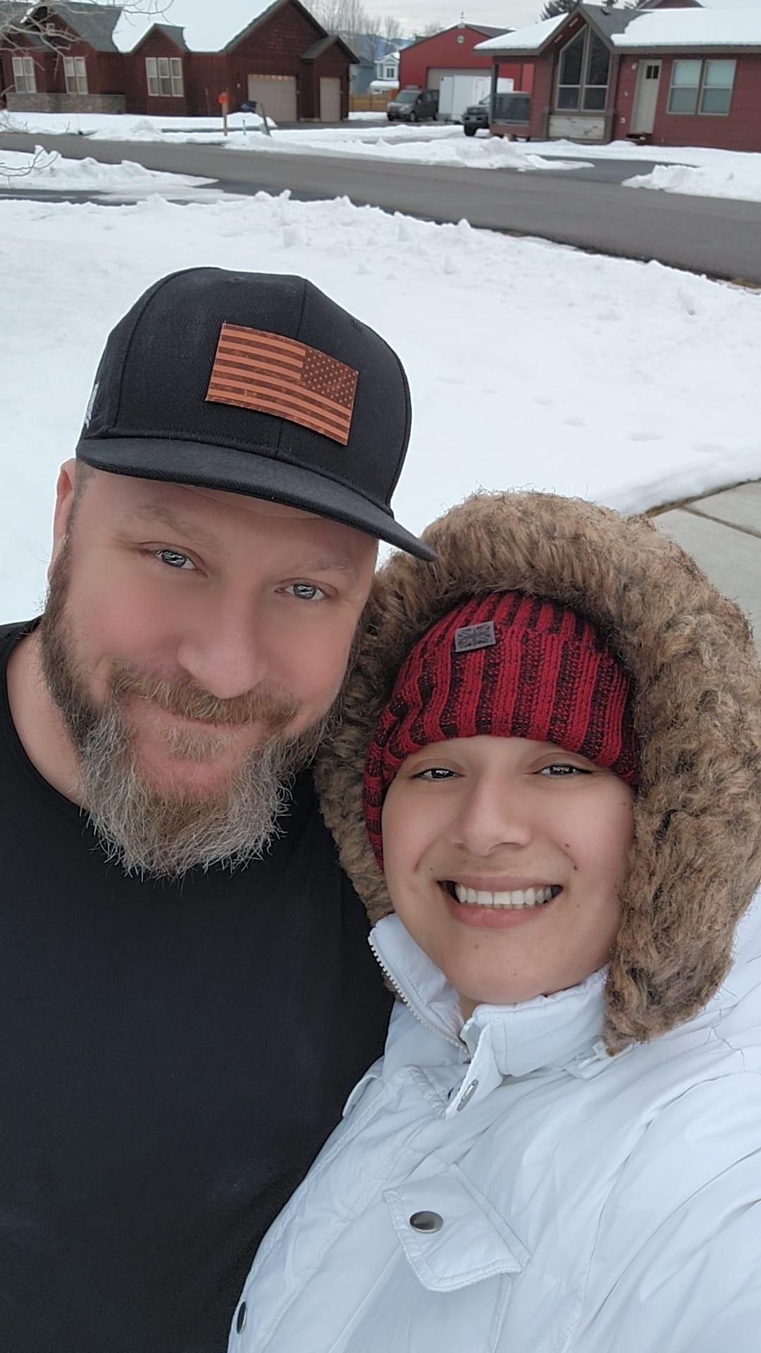 This photo was taken during our family vacation at my dad’s house in Alpine, Wyoming. It was a chilly, overcast day, and Nancy, bundled up like an adorable Eskimo in her cozy white jacket and beanie, was doing her best to stay warm. Brian, being a true Wyoming native, felt perfectly fine in just a t-shirt, embracing the cold air like an old friend.

We both cherish being here, especially in the winter. The crispness of the air and the comforting scent of wood-burning fireplaces fill our hearts with peace. Being surrounded by snow-covered houses and the serene quiet of the season reminds us of how much we love this place and the life we’re building together. Moments like these that are simple, pure, and filled with love.... are the ones we will hold onto forever.  🤍