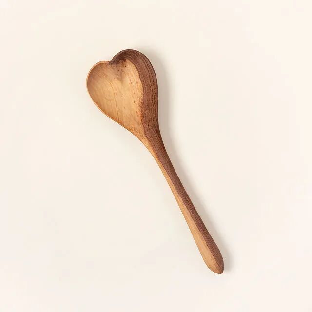 wooden spoon with the scooping end in the shape of a heart