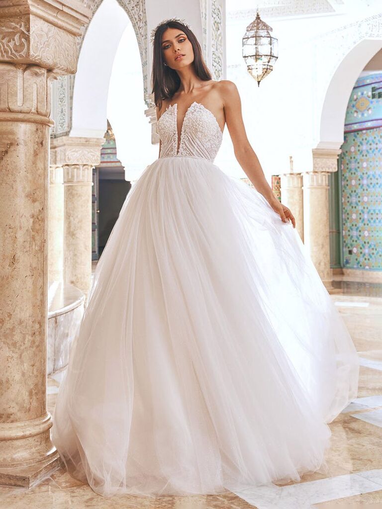 pronovias white strapless wedding dress with deep v beaded chest and plain tulle ball gown skirt