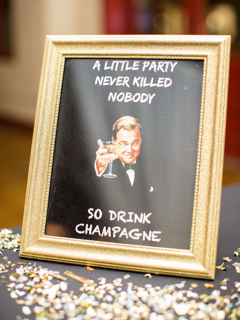 framed sign with leonardio dicaprio great gatsby meme that says a little party never killed nobody, drink champagne