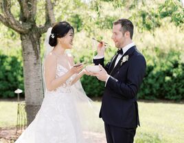 Bride and groom sharing noodles