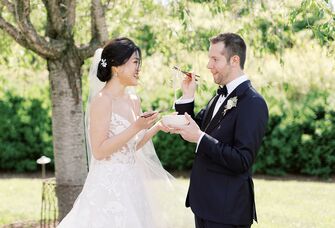Bride and groom sharing noodles