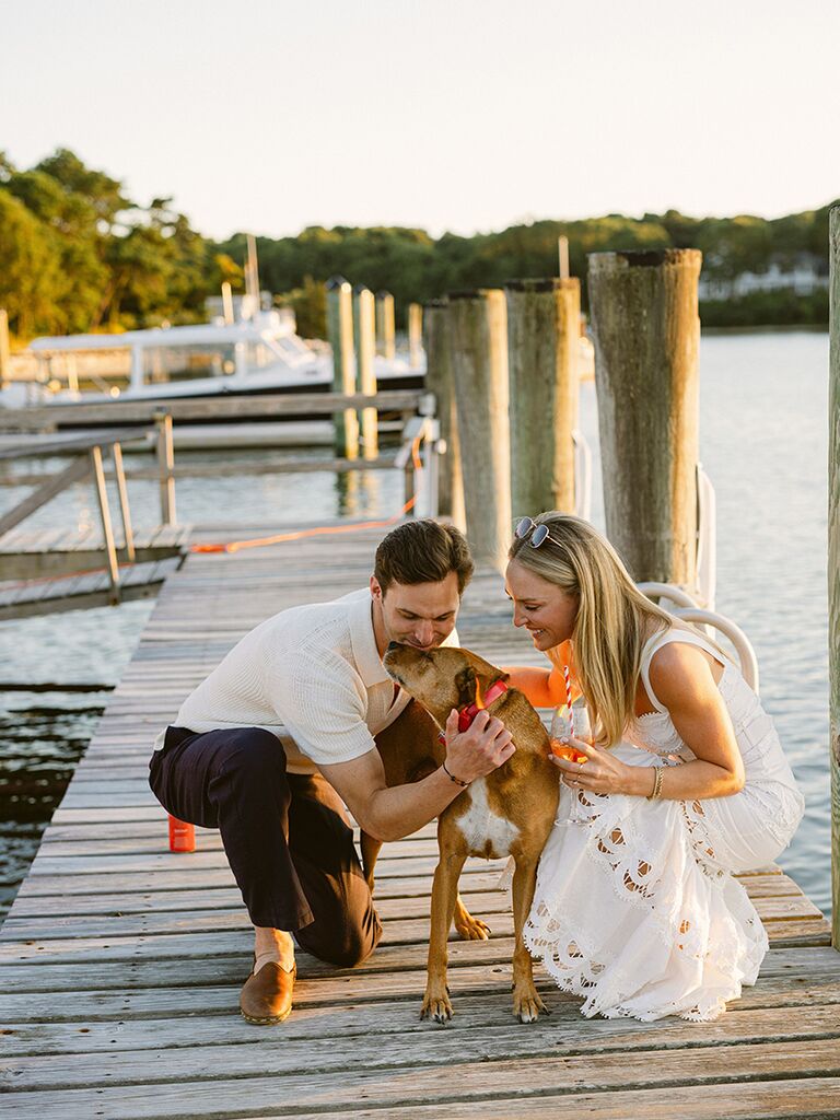 Couple with dog by the sea