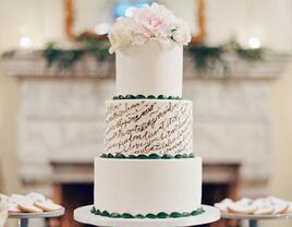 white fondant wedding cake with script detail