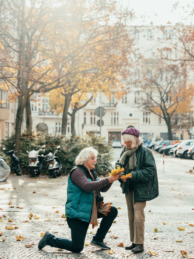 a couple collecting leaves 