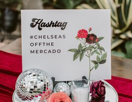 Retro wedding hashtag sign that says "#ChelseasOffTheMercado"