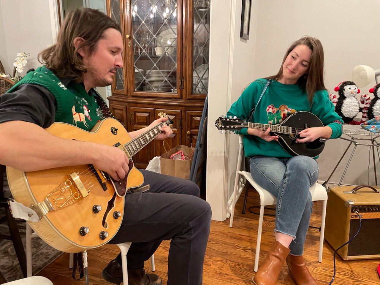 Our first Christmas together was enjoyed with family. This is a photo of us playing a song together for our family tradition, Geeks on Wheels. 