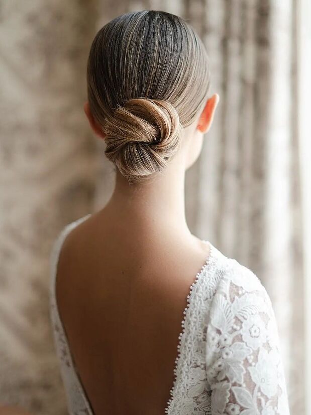 Tight twisted bun wedding updo for long hair