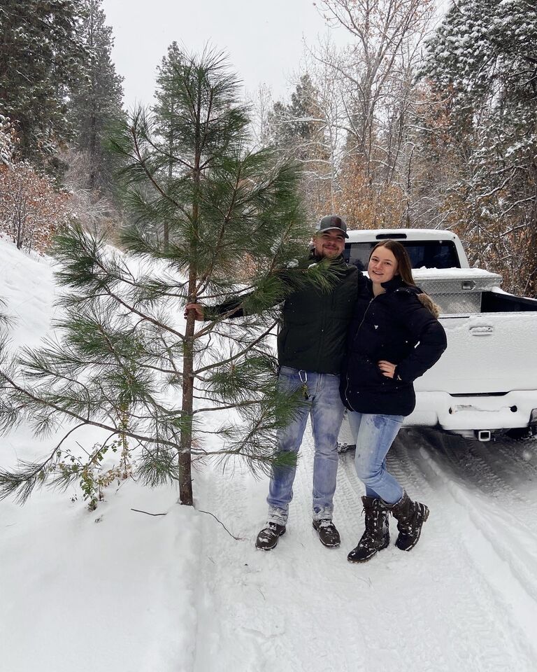 We moved into our first place together in North Bend in the Fall of 2022. I couldn't wait for our first Christmas season together in our own place. Here we our with our Charlie Brown tree we chopped down!
