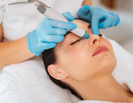 woman getting dermalinfusion facial