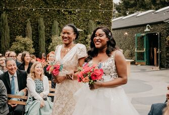 Bride and mother of the bride walking down the aisle