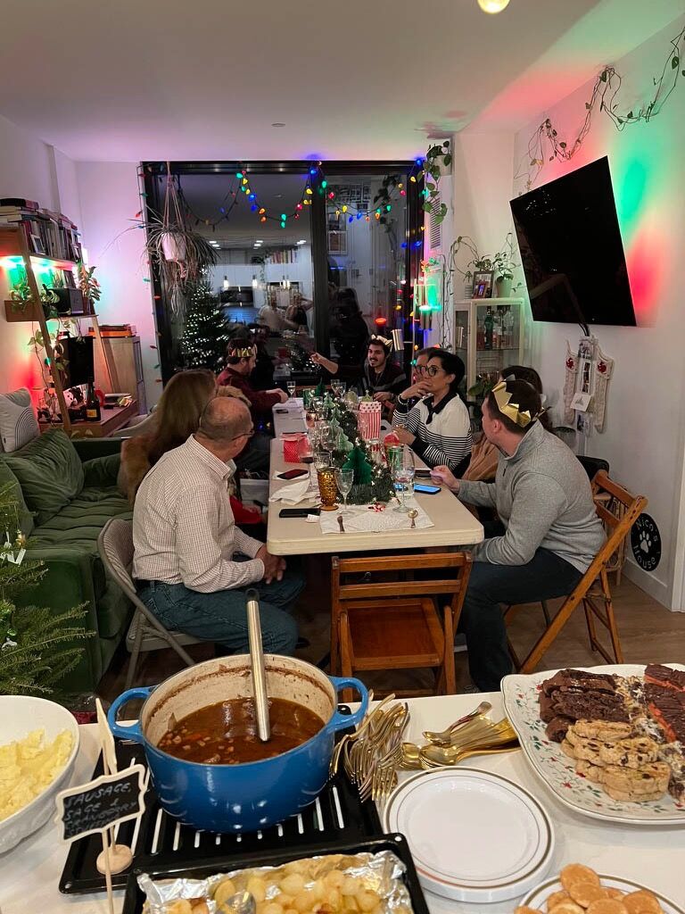 Through some minor miracle of engineering, Matt and Rebecca manage to host 14 Bacchis in their tiny apartment for a Christmas dinner.