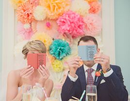 Newlyweds looking at wedding books