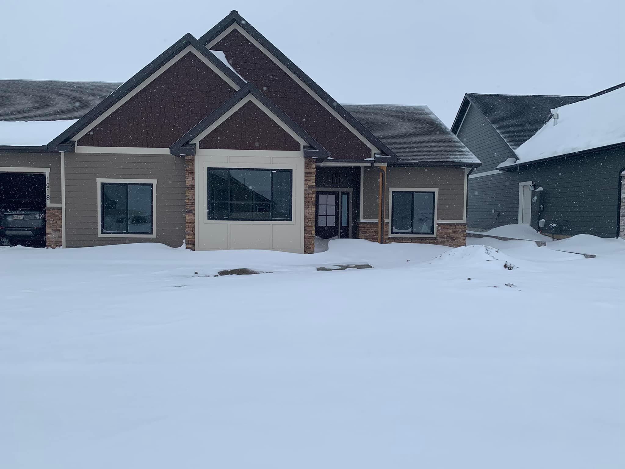 The second home (and first torrential downpour of snow). About two weeks after we moved into our Billings house, we got 12+" of snow in one day. The Texas and California natives had no idea what to do with their driveway. Meagan immediately wanted to buy a flamethrower. 