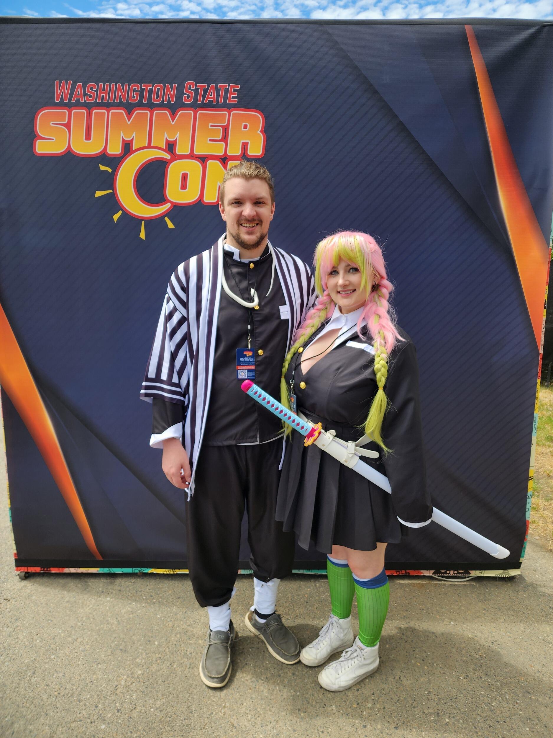 Couple of nerds at Comicon - Cosplaying characters from an anime