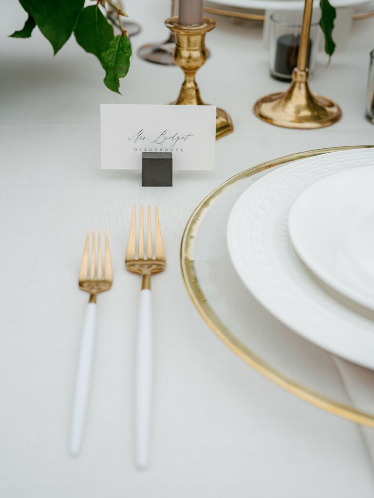 Foil accented and neutral-toned wedding place settings.