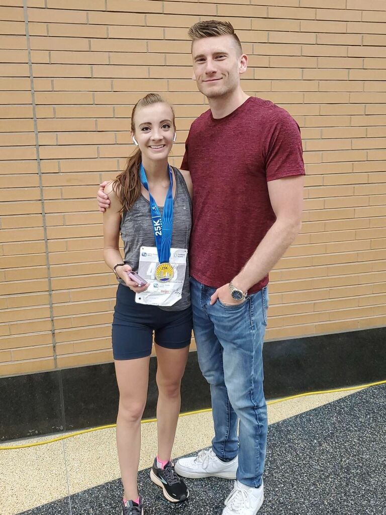 Jon is there to support Megan's running and races. 
