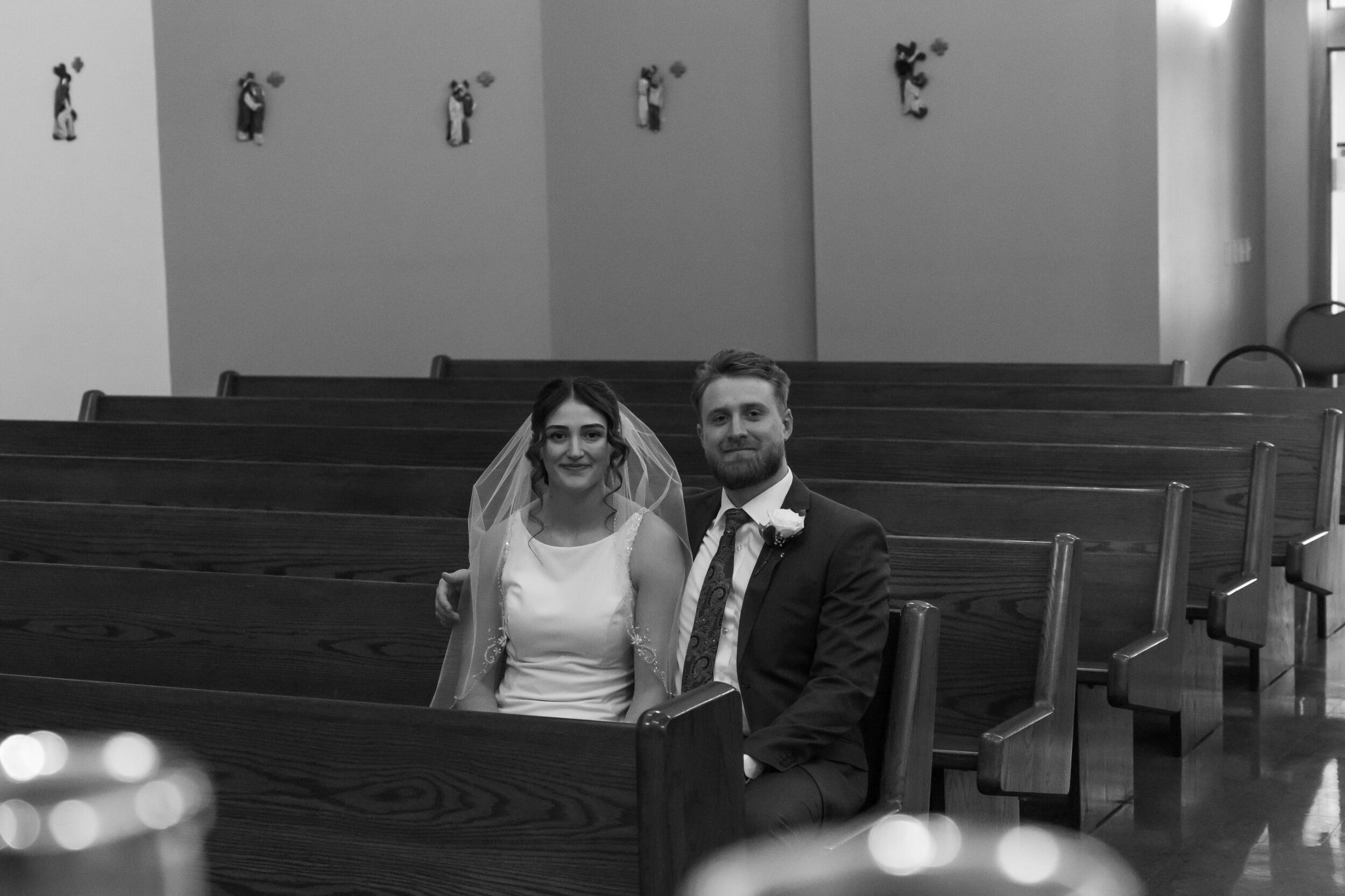 Madelyn and Jayden get married in the Newman Center in Rapid City, SD with their parents, grandparents, and siblings present.