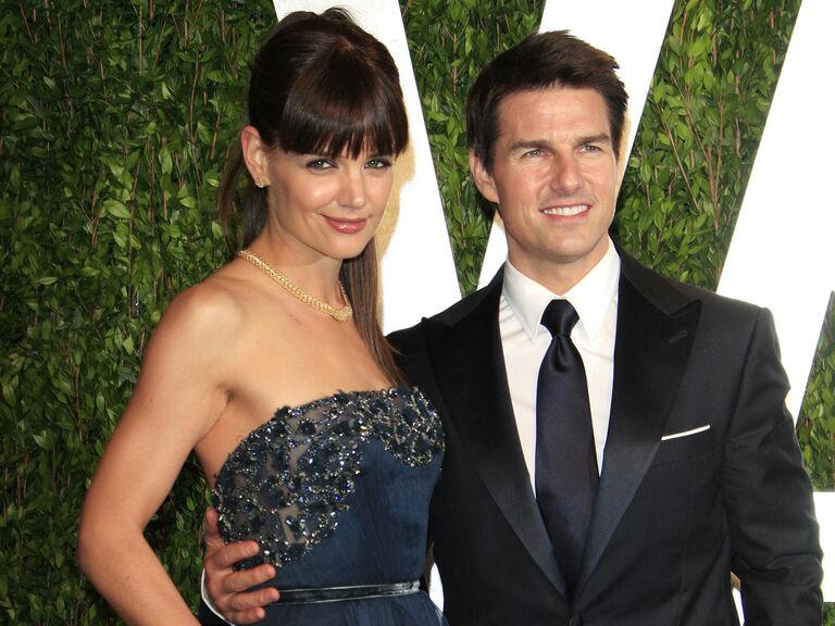 Katie Holmes and Tom Cruise pose at an event together