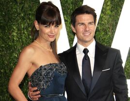 Katie Holmes and Tom Cruise pose at an event together