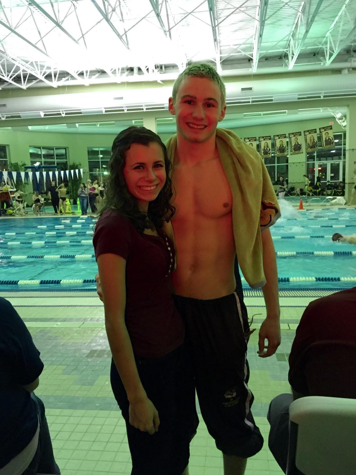 Joanna cheering Max on at his Senior Night for Stow's swim team. 