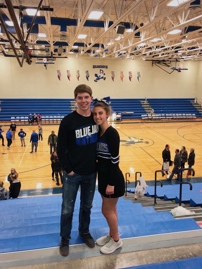 One of our first pictures together after a basketball game where Cara cheered and Caleb announced. We started dating in February 2018. 