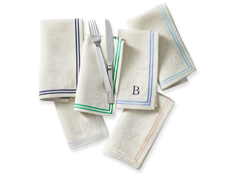 Linen napkins with colored stripes on borders and initial or monogram