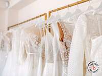 Wedding dress shopping selection of dresses on a rack