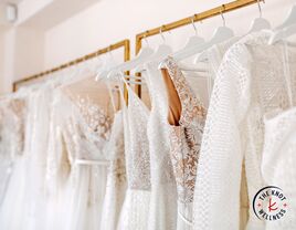 Wedding dress shopping selection of dresses on a rack