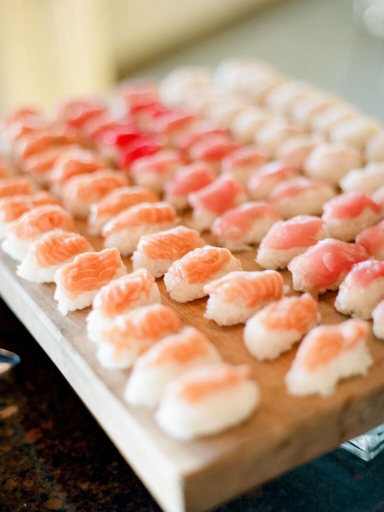 A tray of sushi nigiri with tuna and salmon for your wedding food ideas