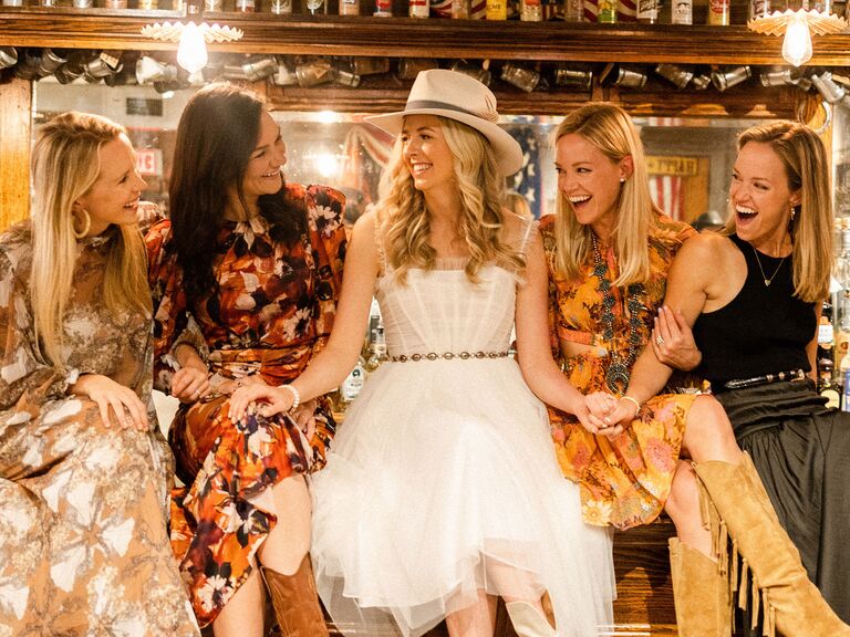 A bride enjoys her bridal shower with her wedding party.