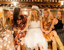 A bride enjoys her bridal shower with her wedding party.