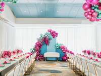 colorful hot pink and turquoise balloon backdrop at ballroom bridal shower