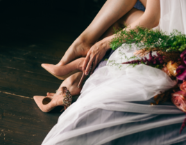 Bride putting on heels before the wedding