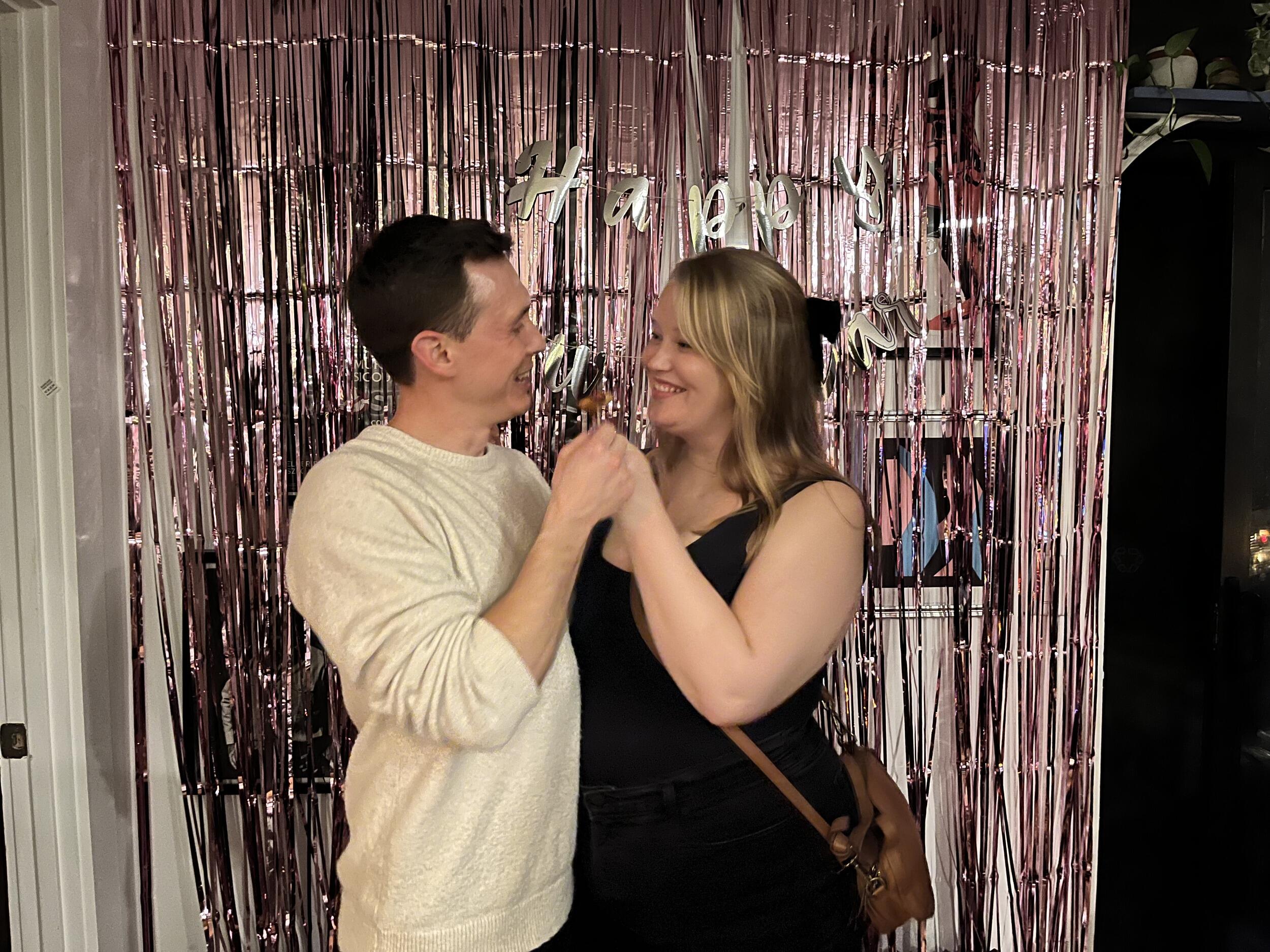 Hannah didn't know it yet, but here they were practicing for feeding each other wedding cake someday with pigs in a blanket at a NYE party.  