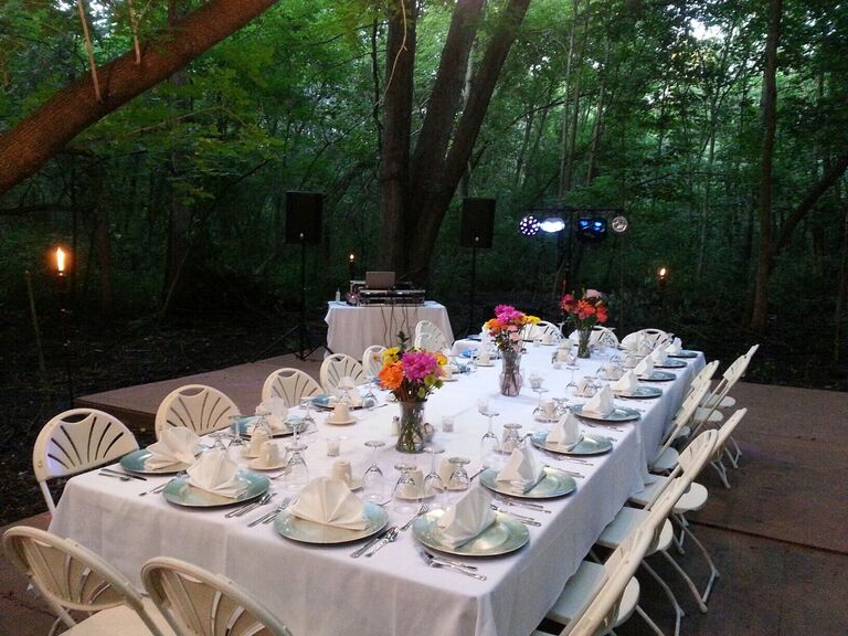 Outdoor DJ booth beside reception table