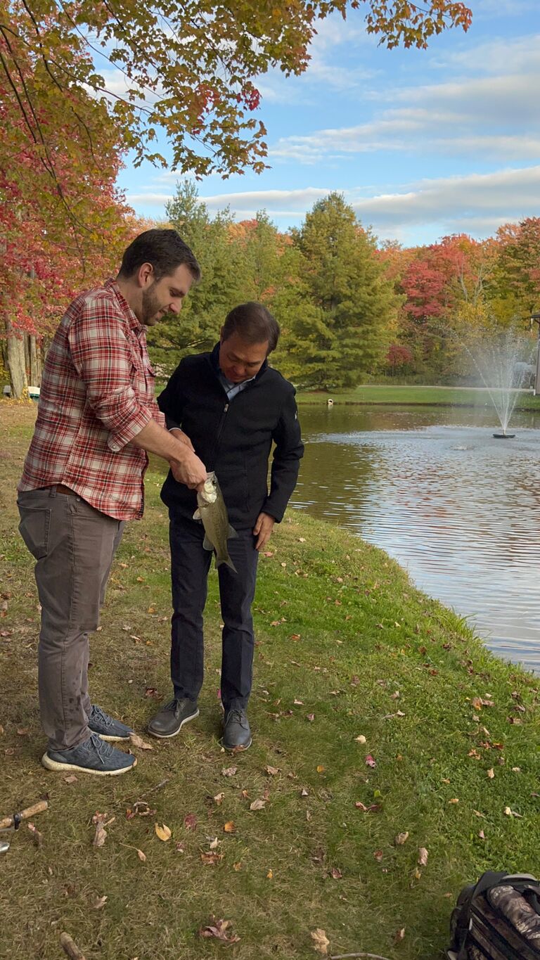 A picture of my dad and Nick in Nick’s parent’s backyard pond. This was the day both of our parents met for the first time! My dad had never fished before so Nick wanted to show him how! It was a magical fall day.