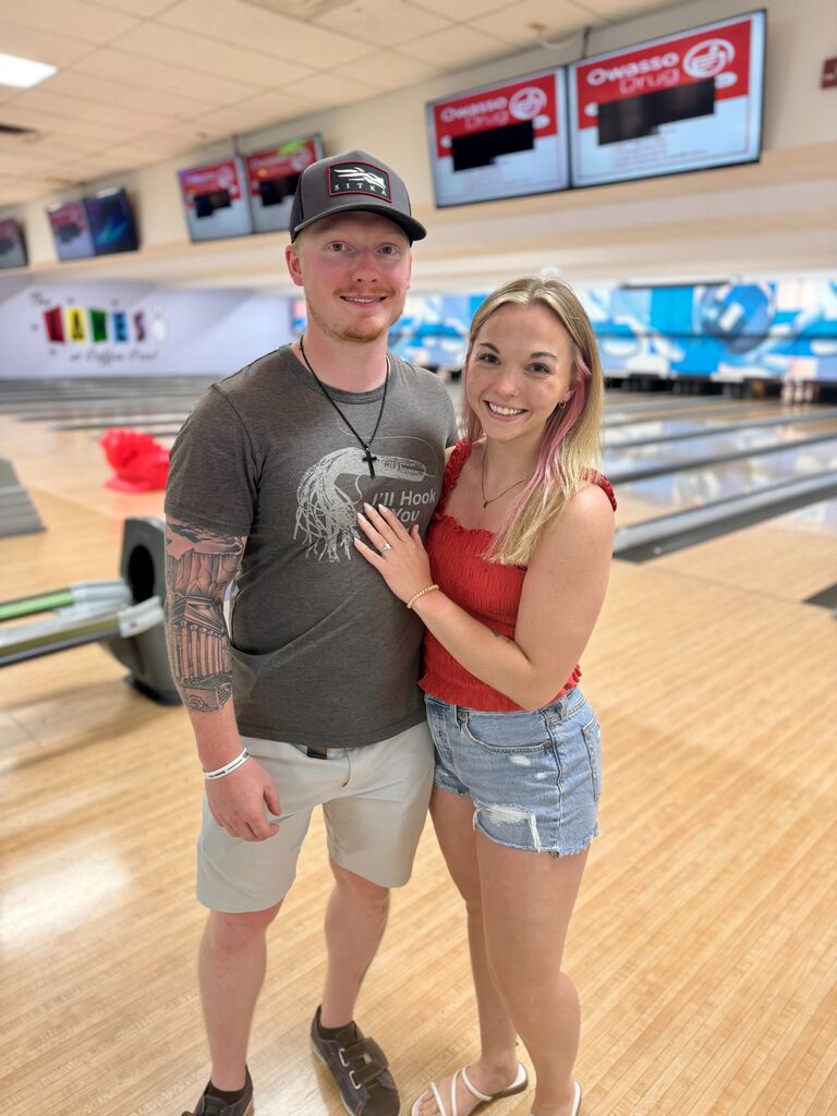 The moment after we got engaged during the recreation of our first date