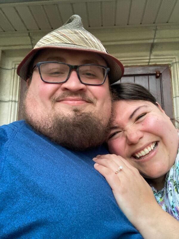 This photo is from the night Adam proposed! Here we're waiting for a table at the local Italian restaurant, Vinny Vanucci's (and making all of the initial obligatory engagement calls). :)