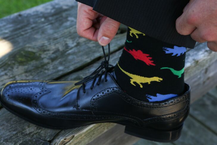 Groomsmen dinosaur wedding socks in green, yellow, red and blue
