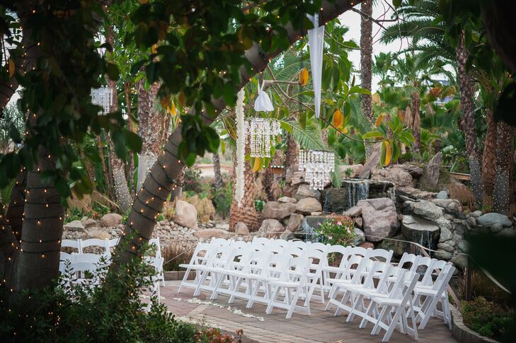 White Folding Chairs At Tropical Ceremony