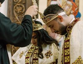A couple receive a wedding blessing during a traditional Coptic ceremony.