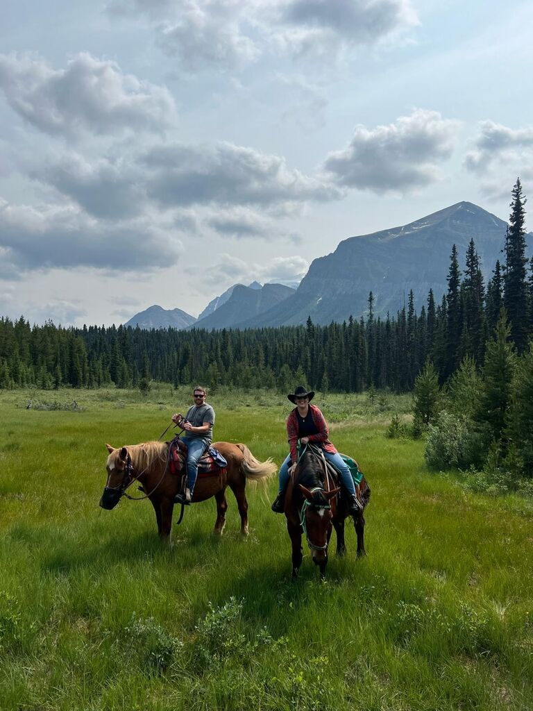 Saddle up! Two lovebirds riding into the Canadian wild.