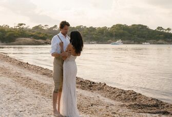 Kendall and Damien on the beach at their wedding reception.