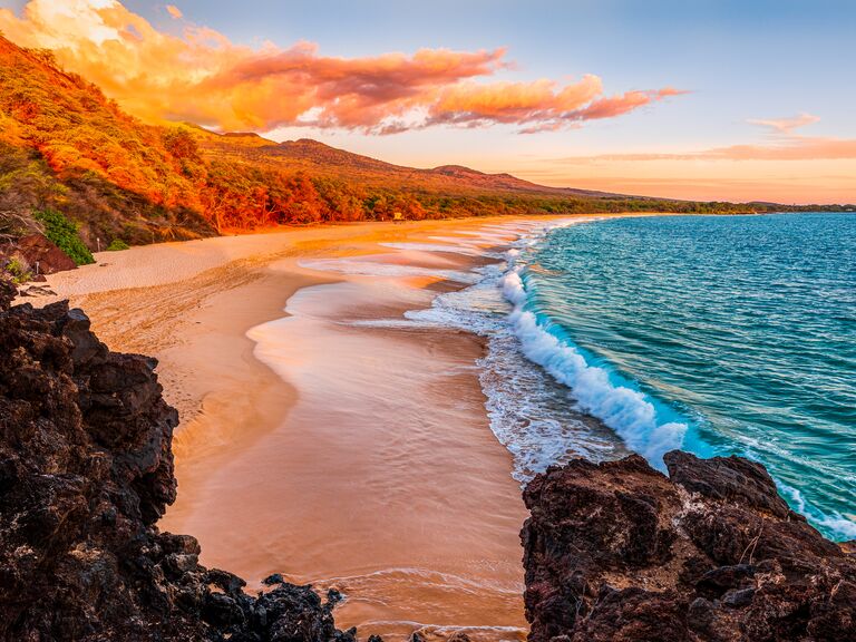 The sun rises over Makena Beach in Maui, Hawai'i.